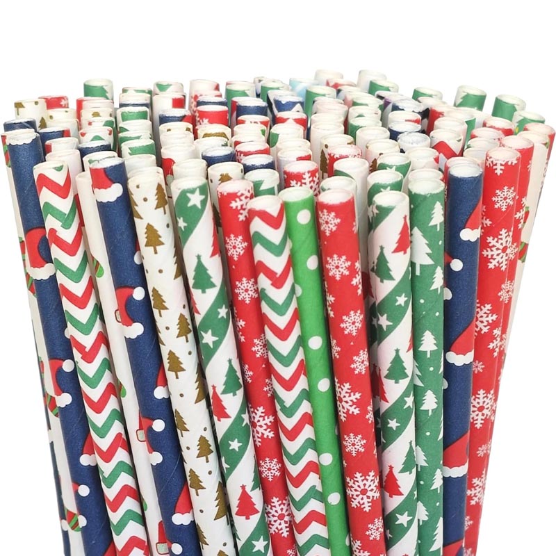 Christmas biodegradable paper straw for party drinks. Patterns include green and red Christmas tree, Christmas hat, snowflake, dots.