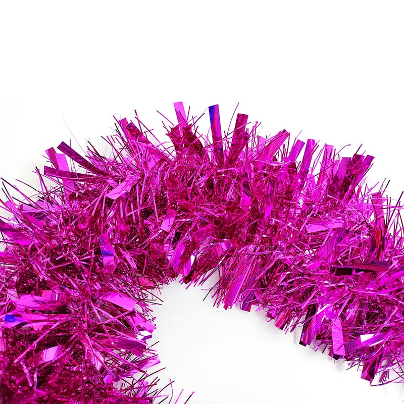 Colorful green, purple, hot pink, silver, blue, red, yellow metallic tinsel garland hanging for decorations, Christmas, birthday, wedding, anniversary, engagement 