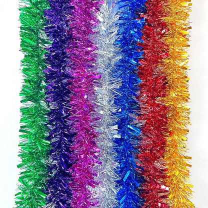 Colorful green, purple, hot pink, silver, blue, red, yellow metallic tinsel garland hanging for decorations, Christmas, birthday, wedding, anniversary, engagement 