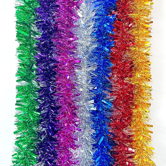 Colorful green, purple, hot pink, silver, blue, red, yellow metallic tinsel garland hanging for decorations, Christmas, birthday, wedding, anniversary, engagement 