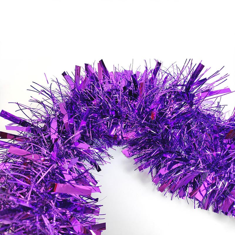 Colorful green, purple, hot pink, silver, blue, red, yellow metallic tinsel garland hanging for decorations, Christmas, birthday, wedding, anniversary, engagement 