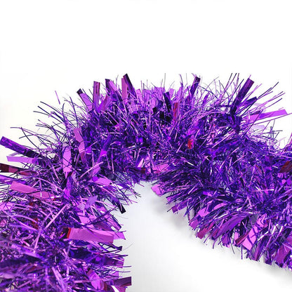 Colorful green, purple, hot pink, silver, blue, red, yellow metallic tinsel garland hanging for decorations, Christmas, birthday, wedding, anniversary, engagement 